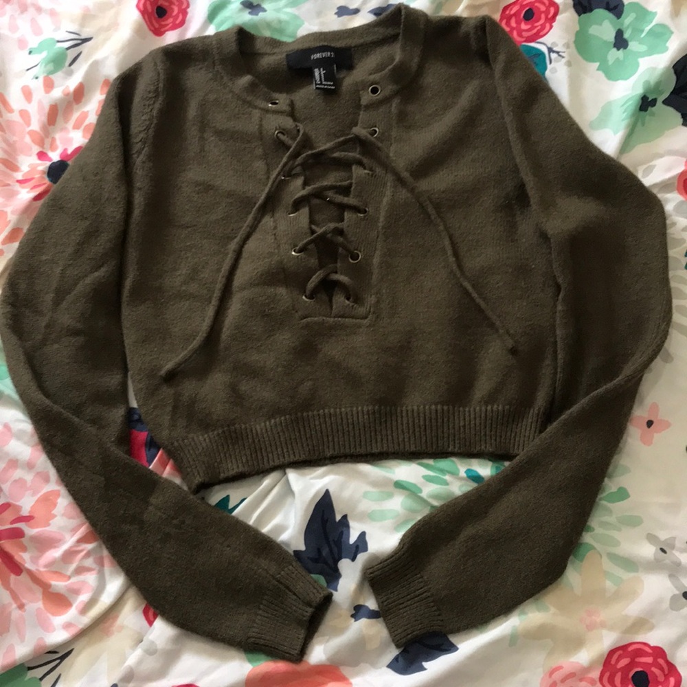 Cropped sweater top with lace up detail